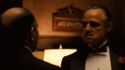 Tuxedo Man Talking To Another By Sign A GIF