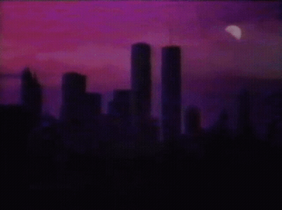 Twin Towers Lit Up At Night GIF