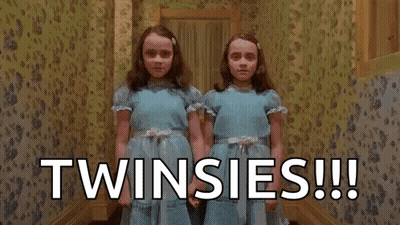 Twins From The Shining Holding Hands In Hallway GIF