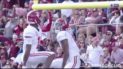 Two Alabama Football Players Ready To Kick Field Goal GIF