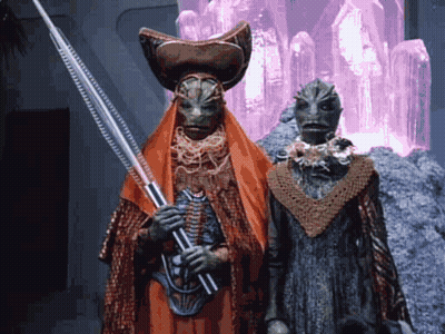 Two Aliens One Holding Spear GIF