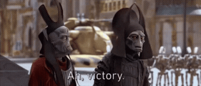 Two Aliens Standing Together Talking About Victory GIF