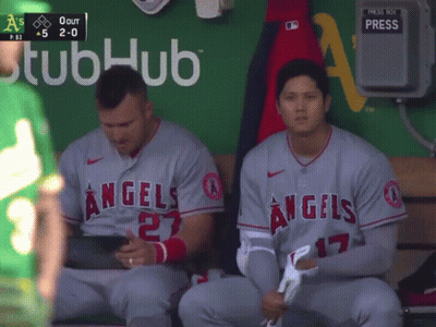 Two Angels Baseball Players Sit On A Bench GIF