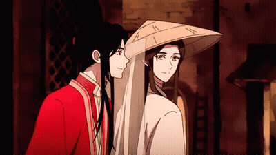 Two Anime Characters Are Standing Next To Each Other GIF