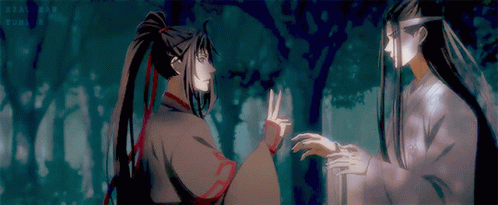 Two Anime Characters Are Standing Next To Each Other In A Forest GIF