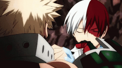 Two Anime Characters , Bakugo And Todoroki , Are Standing Next To Each Other And Looking At Each Other . GIF