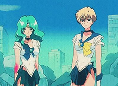 Two Anime Characters Standing In A City GIF