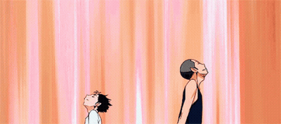 Two Anime Characters Standing, One Smiling GIF