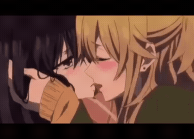 Two Anime Girls Are Kissing Each Other In A Close Up . GIF