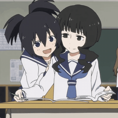 Two Anime Girls Are Sitting At A Desk With A Book GIF