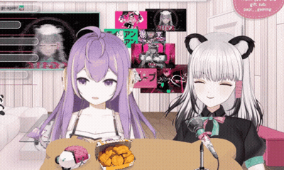Two Anime Girls Are Sitting At A Table With A Box Of Fried Chicken GIF