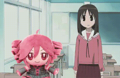Two Anime Girls Are Standing In A Classroom Next To A Stuffed Toy . GIF