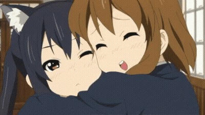 Two Anime Girls Hugging Each Other And One Has A Cat Ear On Her Head GIF