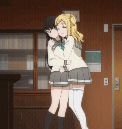 Two Anime Girls Hugging In Front Of Calendar GIF