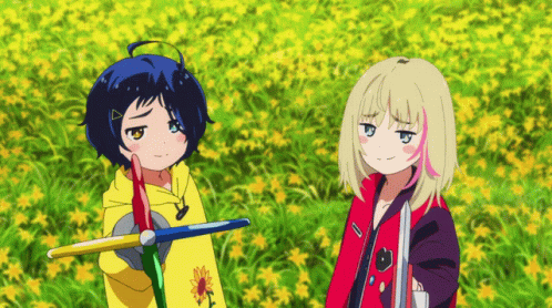 Two Anime Girls Standing In A Field Of Flowers GIF