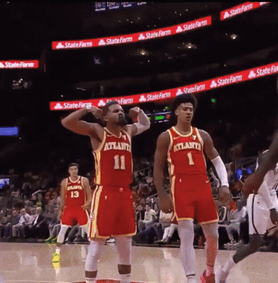 Two Atlanta Basketball Players Standing On Court GIF