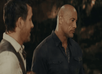 Two Bald Men Are Standing Next To Each Other GIF
