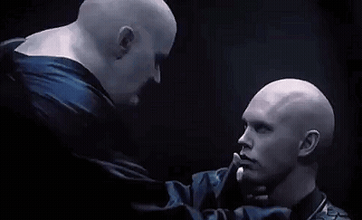 Two Bald Men Kissing In Dark Room GIF