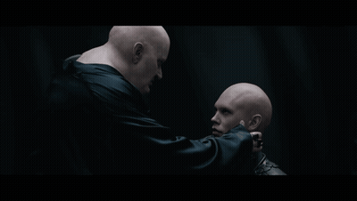 Two Bald Men One Hand On Neck GIF