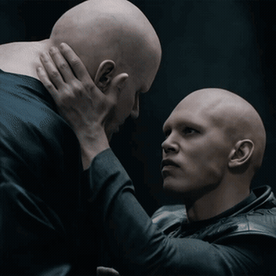 Two Bald Men One Holding Other's Neck GIF
