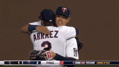 Two Baseball Players Are Hugging Each Other And One Has Arraez On His Jersey GIF