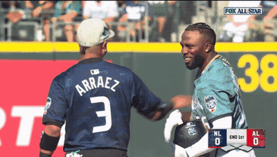 Two Baseball Players Are Shaking Hands During A Game Sponsored By Fox GIF
