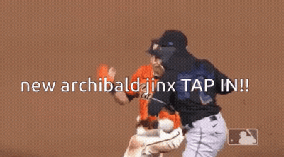 Two Baseball Players Are Standing On A Field With The Words New Archibald Jinx Tap In . GIF