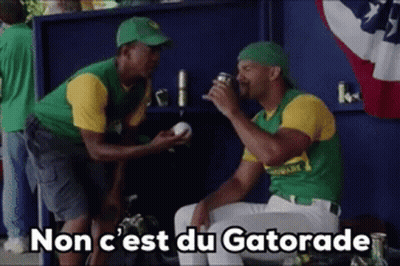 Two Baseball Players Drinking Gatorade In Dugout GIF