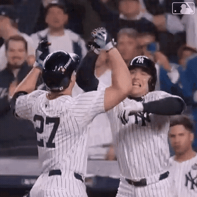 Two Baseball Players High Five On Field GIF