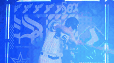 Two Baseball Players Hugging In Front Of Sox Sign GIF