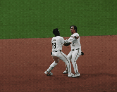 Two Baseball Players Hugging Number 7 GIF