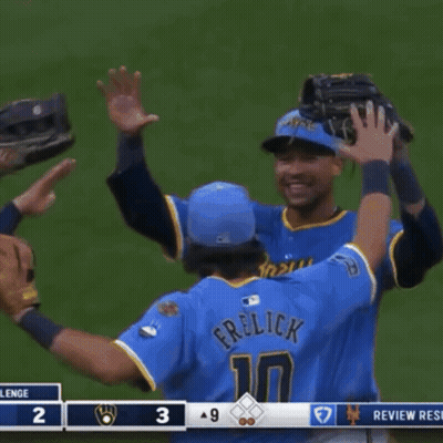 Two Baseball Players Hugging, One Number 7 GIF
