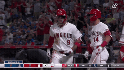 Two Baseball Players In Angels Uniforms Celebrating GIF