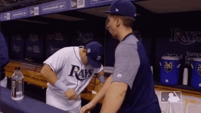 Two Baseball Players In Dugout One In Rays Jersey GIF
