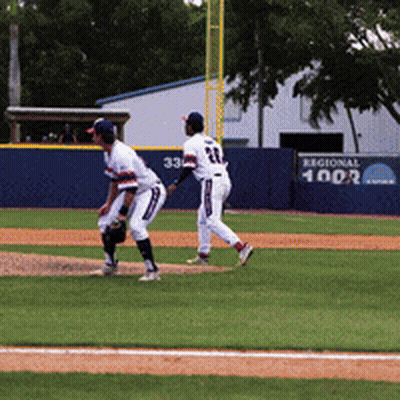 Two Baseball Players In Field With Regional 1902 Sign GIF