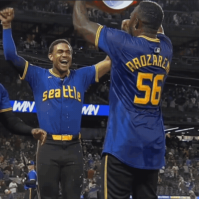 Two Baseball Players In Seattle Jerseys Celebrating GIF