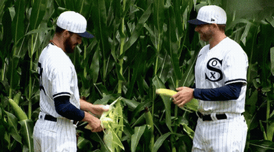 Two Baseball Players In White Uniforms With Letter S GIF