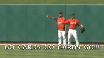 Two Baseball Players On A Field With The Words Go Cards Go Cards Go Written On The Bottom GIF