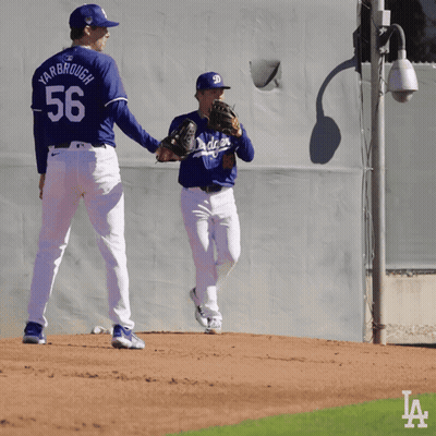 Two Baseball Players One Of Whom Has The Number 56 On Their Back GIF