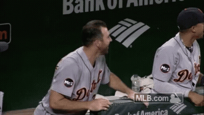 Two Baseball Players Sitting In Front Of Bank Of America Logo GIF