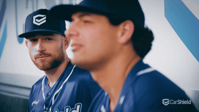 Two Baseball Players Sitting Next To Carsheild Logo GIF
