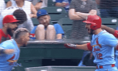 Two Baseball Players Standing In Field GIF