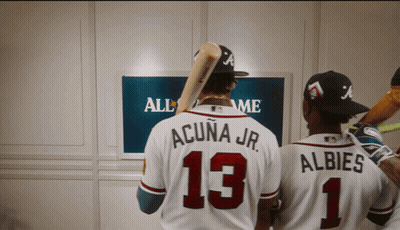 Two Baseball Players Standing In Front Of A Screen That Says All Star Game GIF