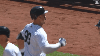 Two Baseball Players Standing Next To Each Other GIF