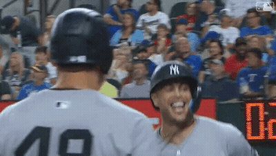 Two Baseball Players Standing Next To Each Other GIF