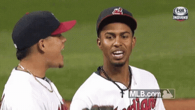 Two Baseball Players Standing On Field GIF
