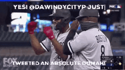 Two Baseball Players Standing On Field GIF