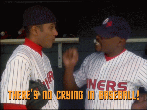 Two Baseball Players Talking In A Dugout With The Words " There 'S No Crying In Baseball " Above Them GIF