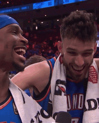 Two Basketball Players Are Laughing And One Has A Towel Around His Neck That Says Thunder GIF