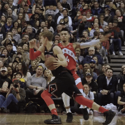 Two Basketball Players Are Playing A Game In Front Of A Crowd And One Of Them Has The Number 4 On His Jersey GIF